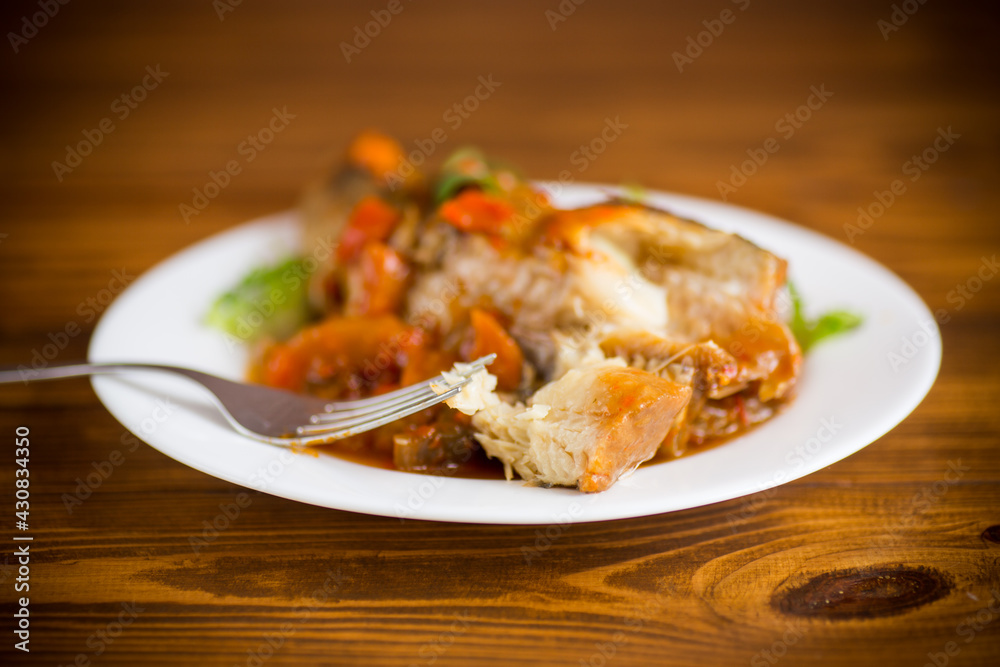 whole fish hake stewed with carrots, beets, peppers and other whole fish hake stewed with carrots, beets, peppers and other