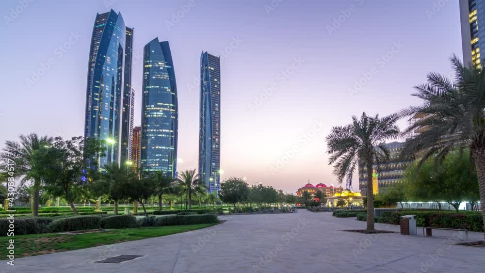 Skyscrapers of Abu Dhabi with Etihad Towers buildings day to night timelapse. Skyscrapers of Abu Dhabi with Etihad Towers buildings day to night timelapse.