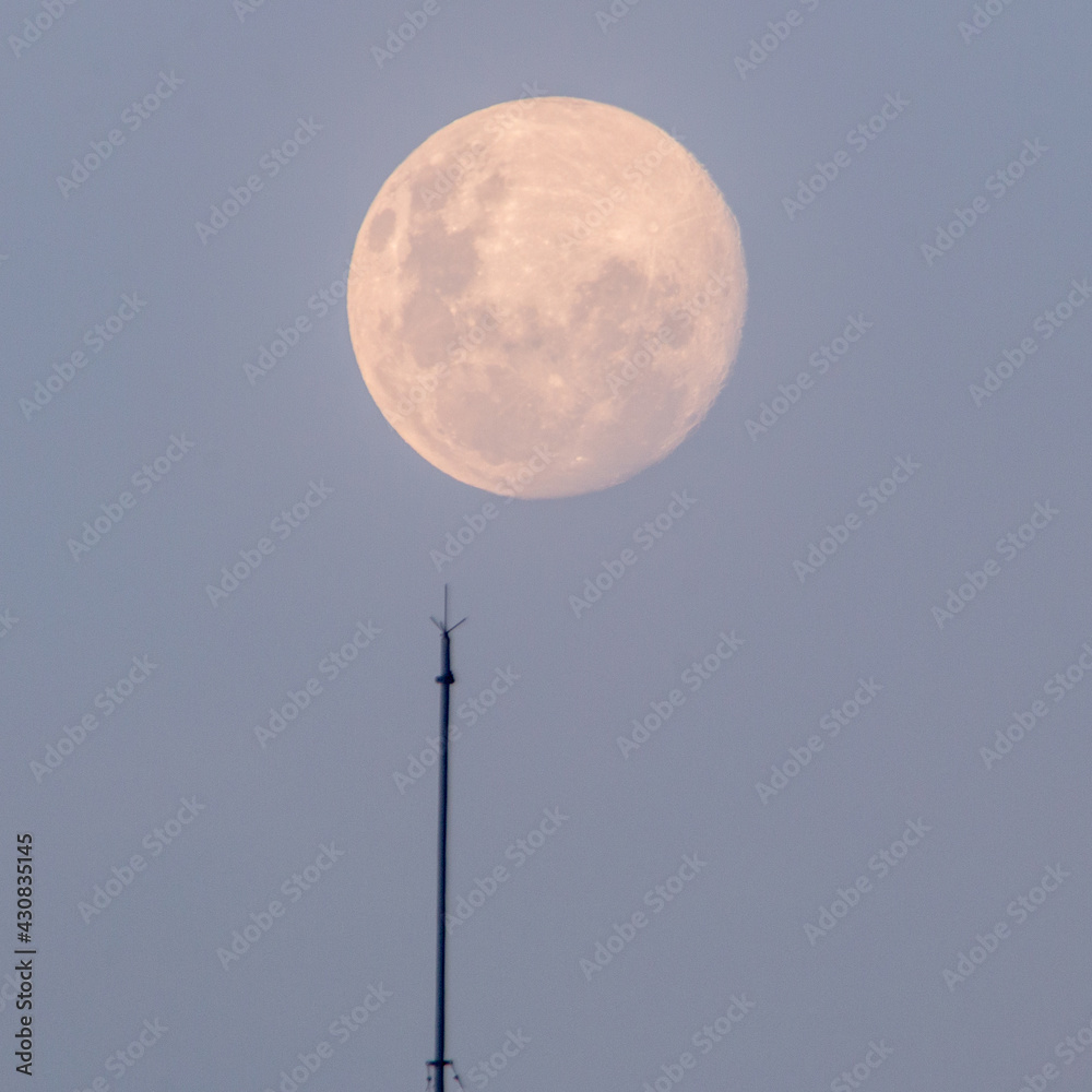 full moon rising seen at ipanema beach in rio de janeiro. full moon rising seen at ipanema beach in rio de janeiro.