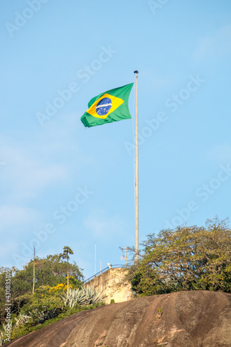 Brazil flag on top of the rudder stone in Rio de Janeiro.