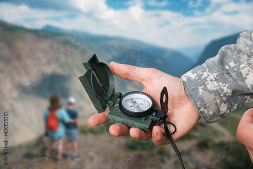 Man with compass in Altai mountains