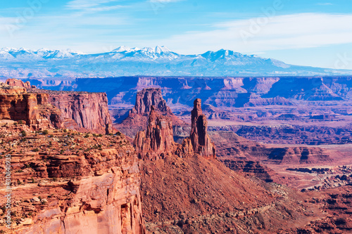 Scenic view of Colorado river canyon, sandstone towers and the La Sal Mountains in the distance at Canyonlands National Park.