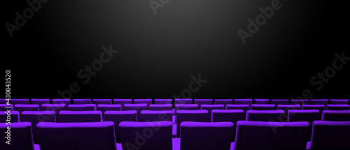 Cinema movie theatre with purple seats rows and a black background. Horizontal banner