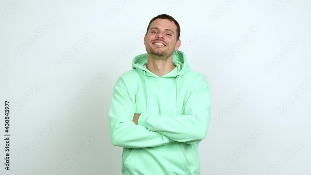 Brazilian handsome man keeping the arms crossed in confident expression over isolated background Brazilian handsome man keeping the arms crossed in confident expression over isolated background