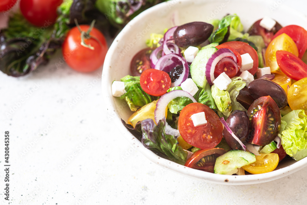 Fresh Greek salad with vegetables and feta cheese Fresh Greek salad with vegetables and feta cheese