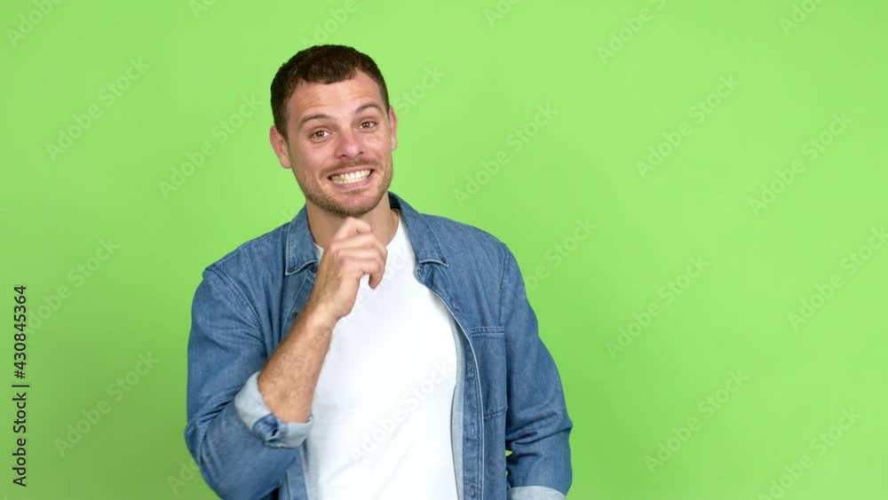 Brazilian handsome man smiling and looking to the front with confident face over isolated background Brazilian handsome man smiling and looking to the front with confident face over isolated background