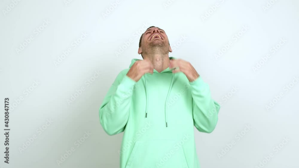 Brazilian handsome man smiling a lot while covering mouth over isolated background Brazilian handsome man smiling a lot while covering mouth over isolated background