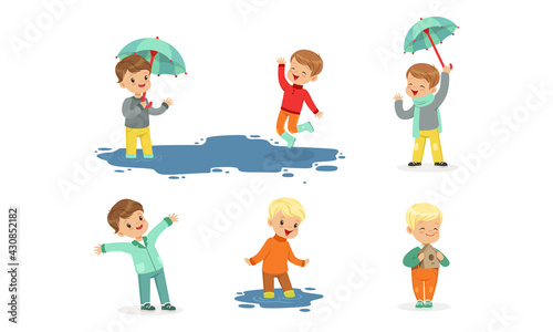 Smiling Little Children Splashing in Puddle Walking in Wet Rainy Day Vector Set