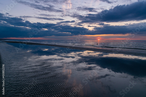 Sunset over the sea. Beautiful reflection.