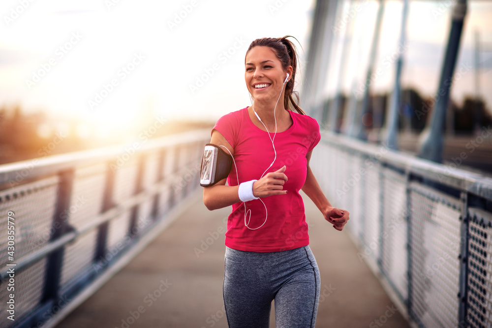 Fototapeta premium Woman running outdoors