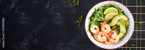 Salad of prawns. Salad of shrimps, arugula, avocado slice, close up. Healthy concept. Top view, banner, flat lay