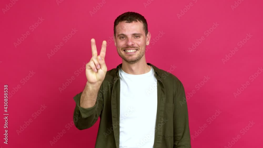 Brazilian handsome man happy and counting with fingers over isolated background Brazilian handsome man happy and counting with fingers over isolated background