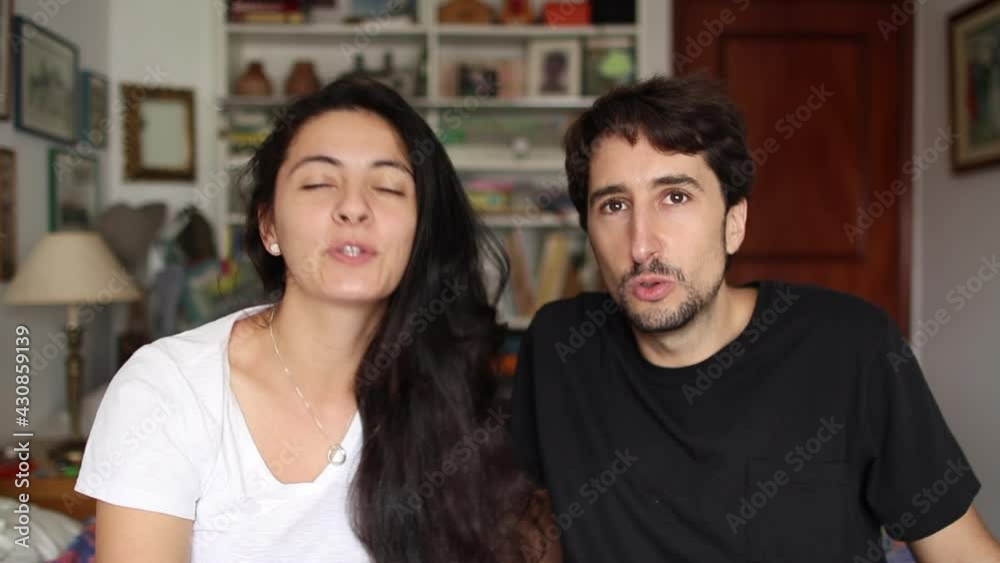 Friends speaking on video call. couple in conversation online to camera Friends speaking on video call. couple in conversation online to camera