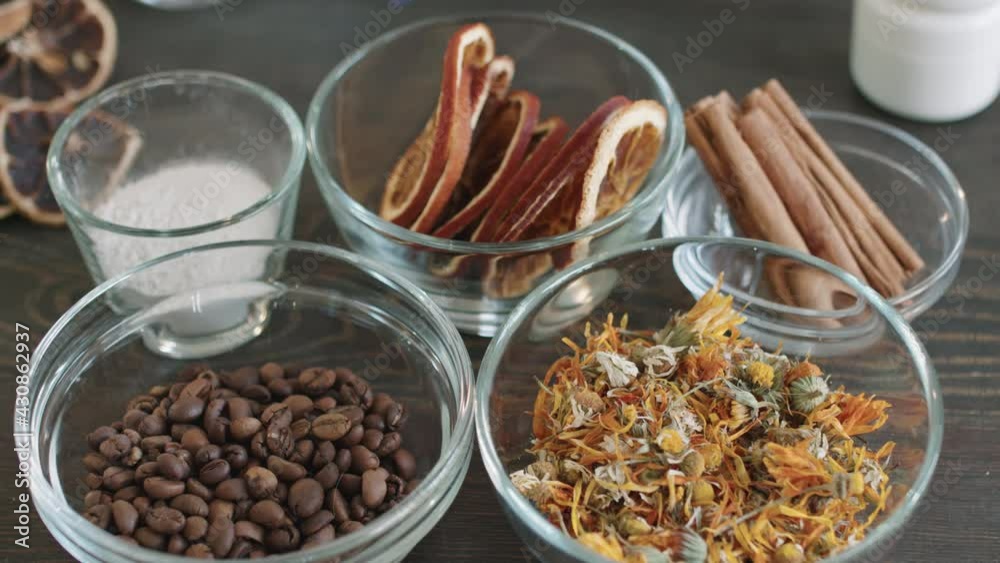 PAN closeup of aromatic dried flowers and fruits, cinnamon sticks and coffee beans used for making natural handmade cosmetic products PAN closeup of aromatic dried flowers and fruits, cinnamon sticks and coffee beans used for making natural handmade cosmetic products