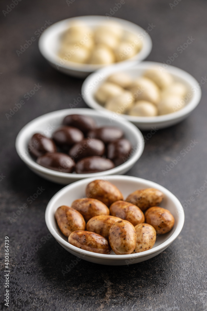 Sweet chocolate almonds. Chocolate eggs in bowl. Sweet chocolate almonds. Chocolate eggs in bowl.