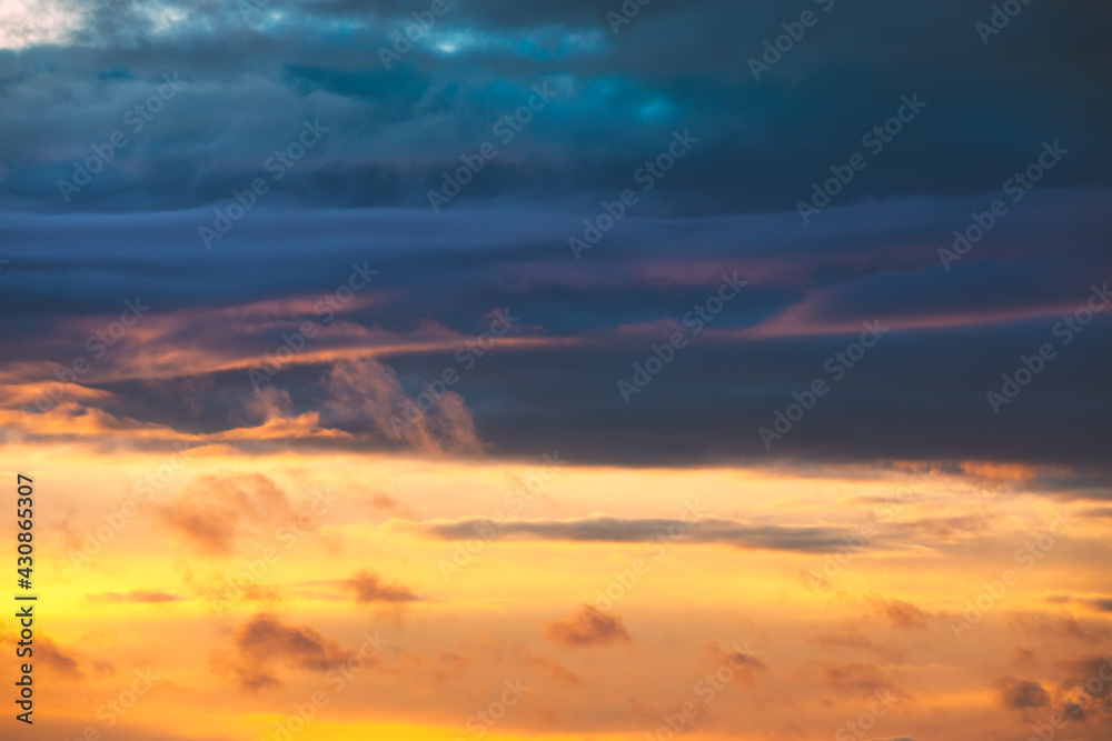 Sunrise Sky. Bright Dramatic Sky With Colorful Clouds. Yellow, Orange And Blue Colours