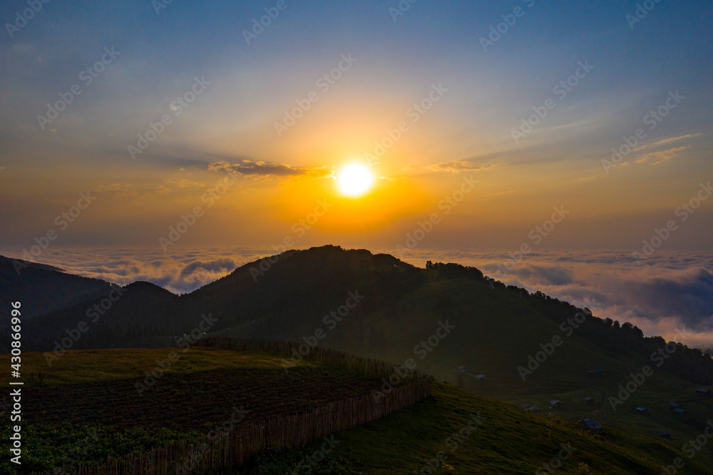 Mountains above the clouds beautiful sunset