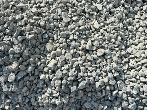 Abstract white crushed stones texture background. Gray rubble construction rock pebble pattern