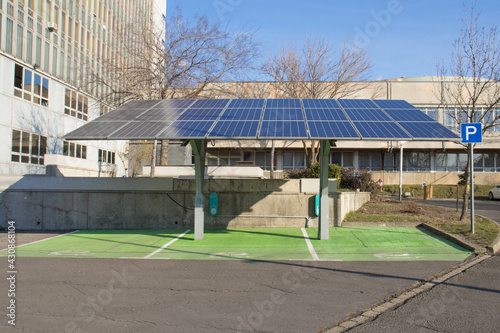 solar panels on top of a electric vehicle charge station