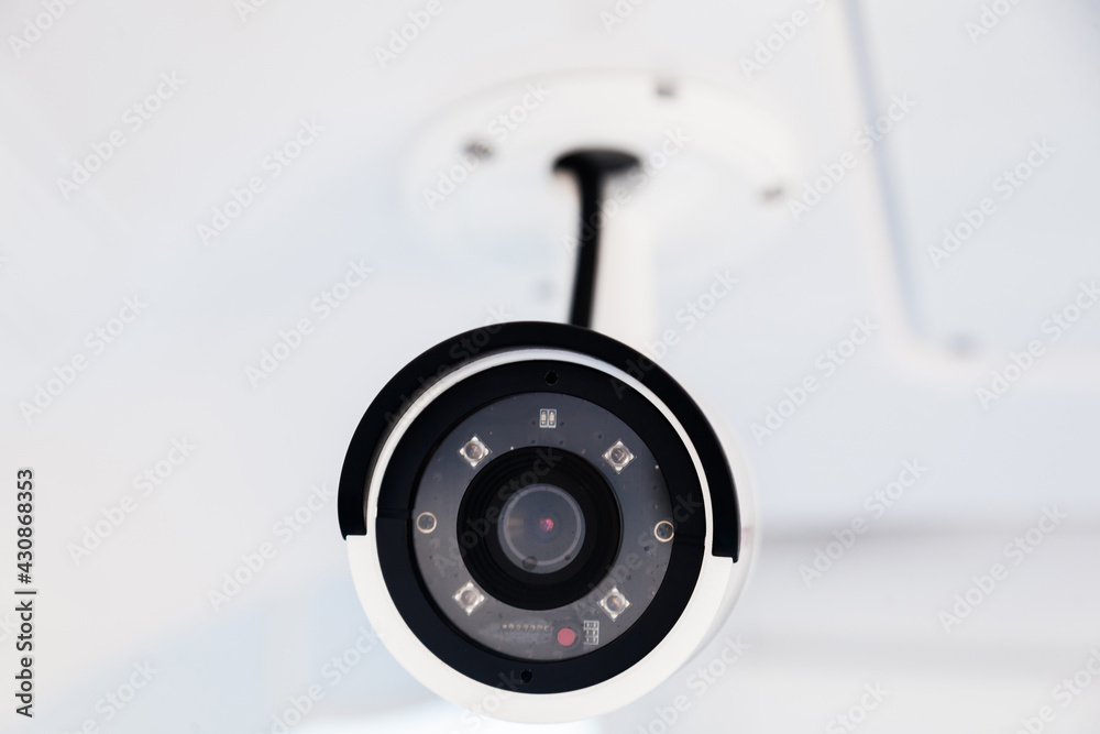 CCTV camera on the hull of an expensive motor yacht. CCTV camera white on a white body. CCTV camera on the hull of an expensive motor yacht. CCTV camera white on a white body.
