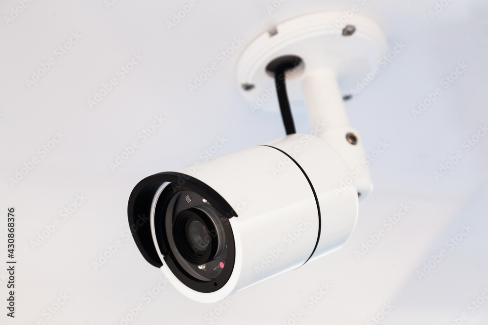 CCTV camera on the hull of an expensive motor yacht. CCTV camera white on a white body. CCTV camera on the hull of an expensive motor yacht. CCTV camera white on a white body.