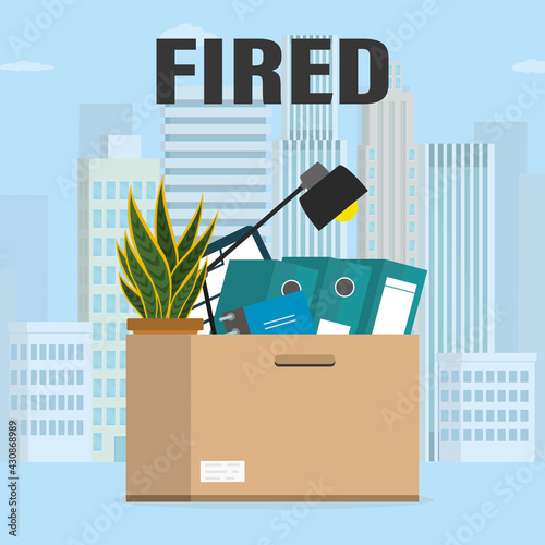 Box with Office things and plant. Fired from job. Dismissal, staff reduction. Optimizing costs during the economic crisis. City view on background.