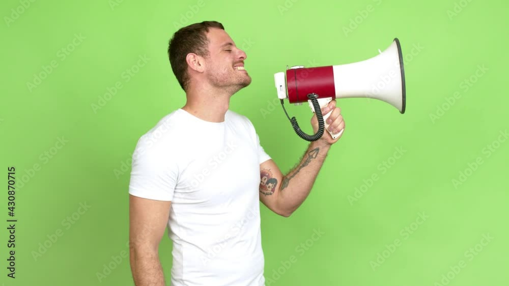 Brazilian handsome man holding a megaphone and shouting over isolated background Brazilian handsome man holding a megaphone and shouting over isolated background