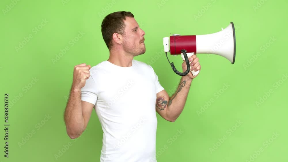 Brazilian handsome man holding a megaphone and shouting over isolated background Brazilian handsome man holding a megaphone and shouting over isolated background