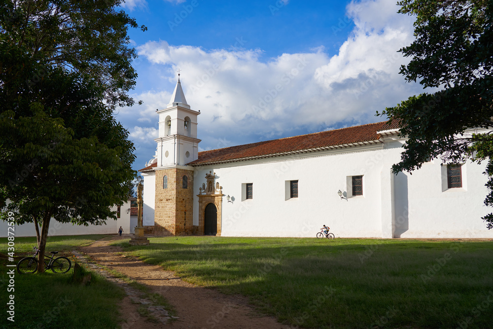            Side of a facade in a church with a bell tower in Villa de Leyva, Colombia.                   