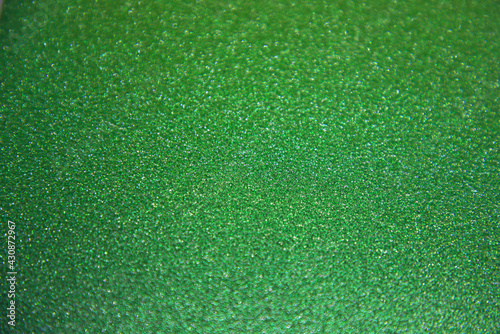 Green glittery shiny background with space to write your text 