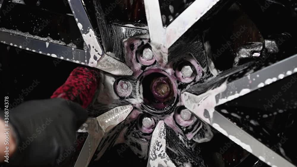 Washing the car wheel rims with neutral pH detergent that removes ferrules, rust and oxide deposits from wheel. It counteracts the action of micro-iron particles and changes the color to purple.