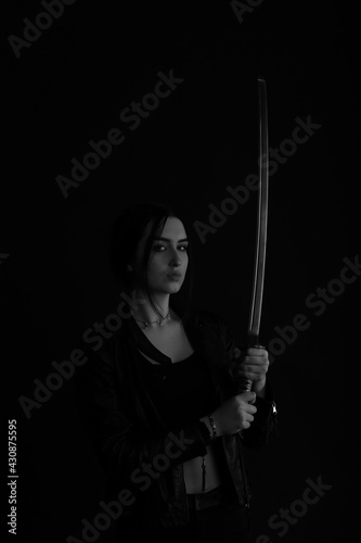 Woman with katana sword in black and white