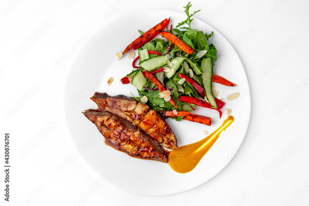 Roasted pike perch in sauce and vegetables. Banquet festive dishes. Gourmet restaurant menu. White background.