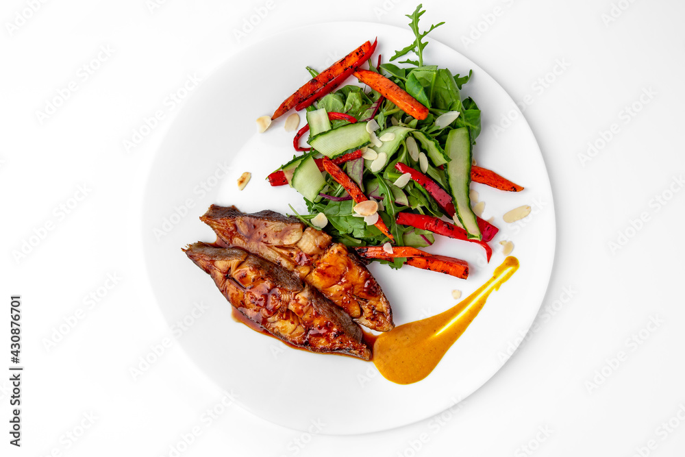 Roasted pike perch in sauce and vegetables. Banquet festive dishes. Gourmet restaurant menu. White background. Roasted pike perch in sauce and vegetables. Banquet festive dishes. Gourmet restaurant menu. White background.
