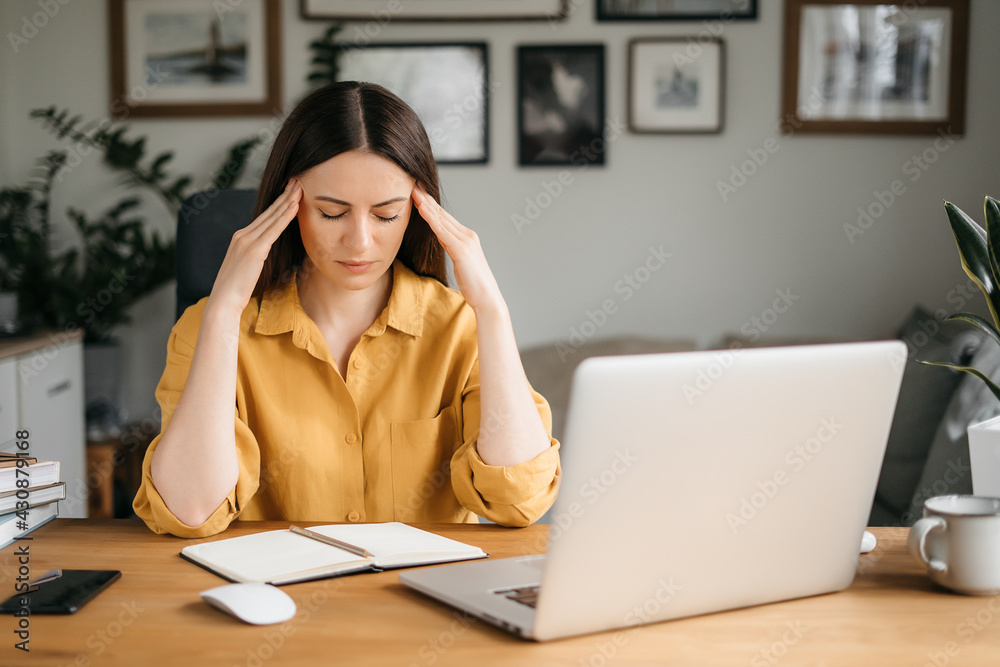 Stressed exhausted young woman tired from computer work feeling fatigue, headache or migraine, overworked teen girl student in panic learning difficult exams preparation, overwhelmed with work tasks Stressed exhausted young woman tired from computer work feeling fatigue, headache or migraine, overworked teen girl student in panic learning difficult exams preparation, overwhelmed with work tasks