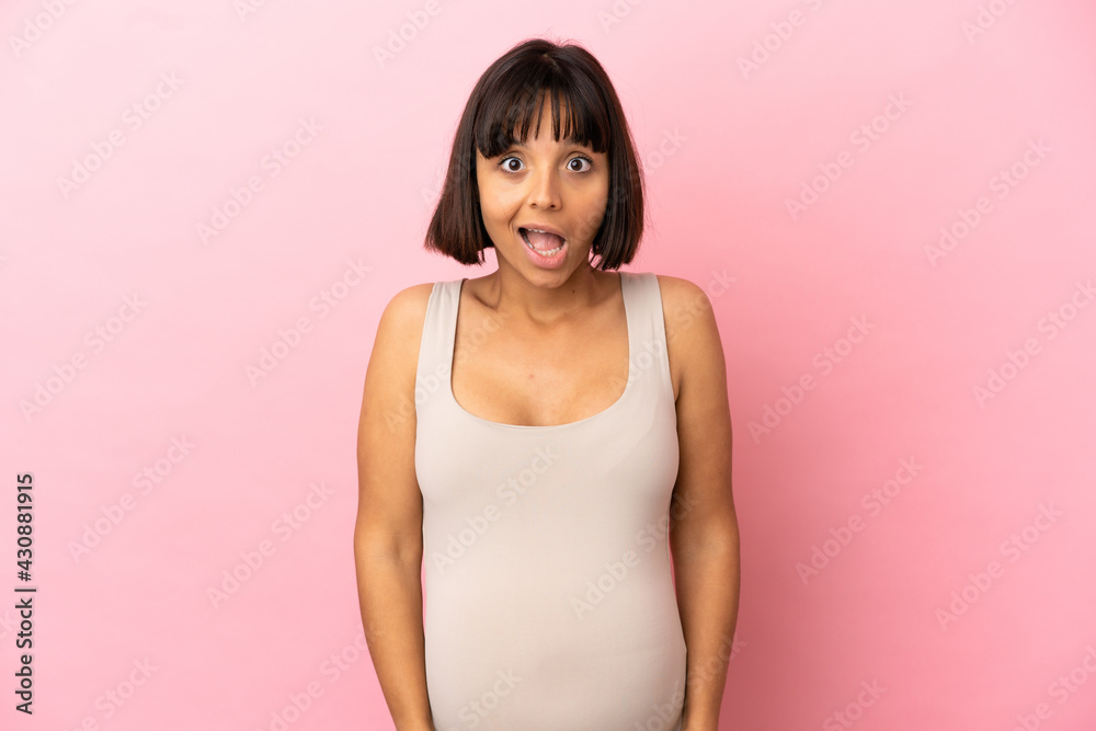 Young pregnant woman over isolated pink background with surprise facial expression Young pregnant woman over isolated pink background with surprise facial expression