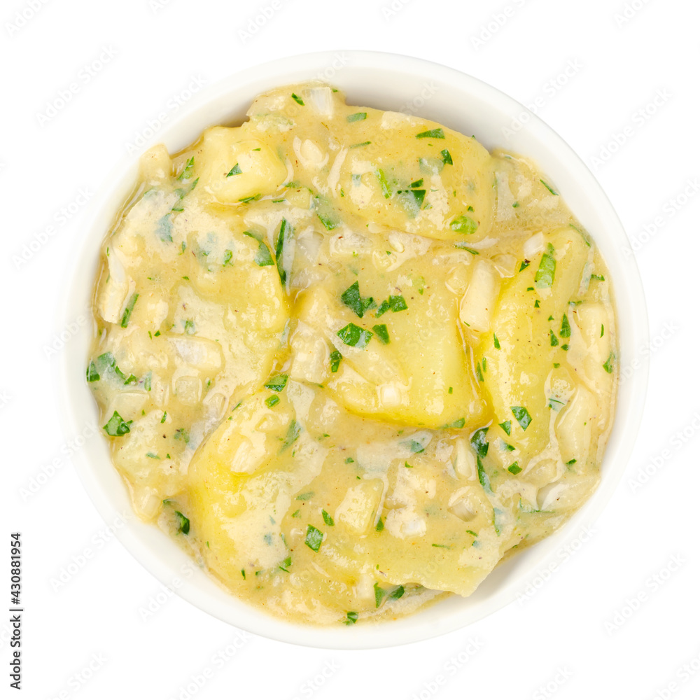 Potato salad with oil and vinegar in a white bowl. Traditional southern German and Austrian side dish made from boiled potatoes, oil, vinegar, onion and parsley. Close up over white, macro food photo. Potato salad with oil and vinegar in a white bowl. Traditional southern German and Austrian side dish made from boiled potatoes, oil, vinegar, onion and parsley. Close up over white, macro food photo.