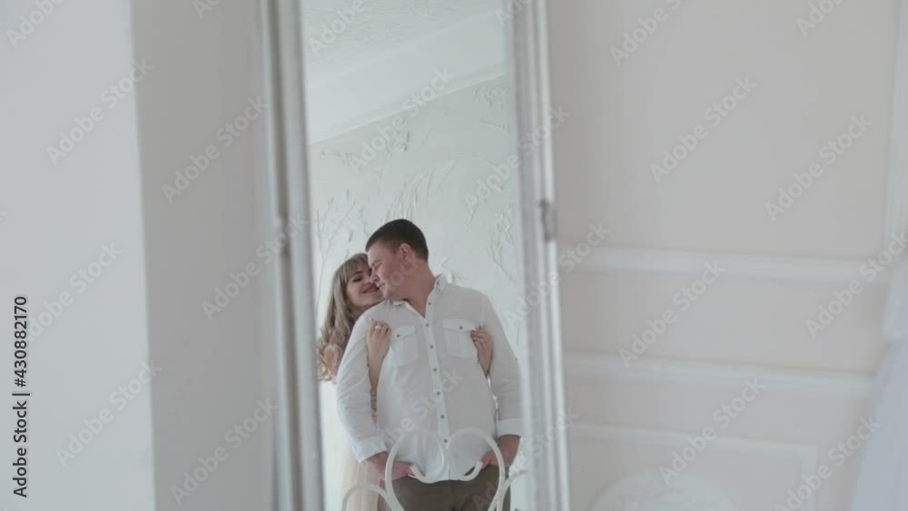 Lovers bask in the light room of the photo studio. Lovers bask in the light room of the photo studio.