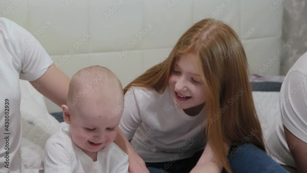 Cheerful happy family on the bed. Cheerful happy family on the bed.