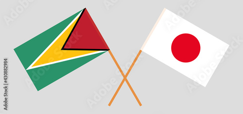 Crossed flags of Guyana and Japan. Official colors. Correct proportion