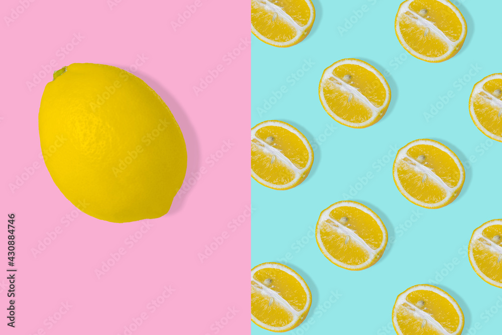 Trendy summer idea Pattern with yellow lemon slice on pastel blue background and whole fresh lemon on light pink background.
