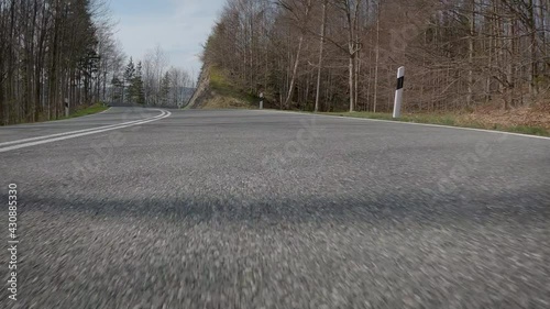 Driving down serpentines road in the mountains