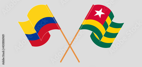 Crossed and waving flags of Colombia and Togo