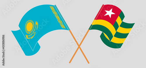 Crossed and waving flags of Kazakhstan and Togo