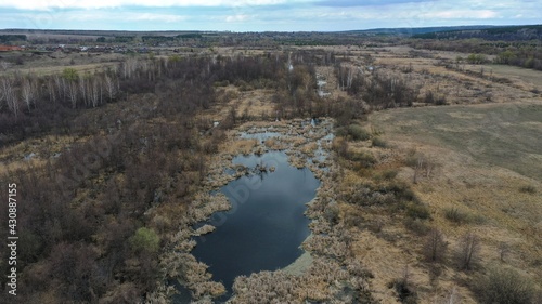 Marshland. Salt marsh fly-through. Panorama of marshland. The wetland was photographed from a height. © Ruslan