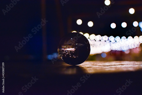 close up of a ball, bokeh lights, party at night, beach, summer 