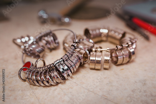 Workshop with goldsmith's tools and finger sizing gauges which are used to determine finger size.
