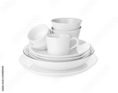 Stack of clean dishware isolated on white