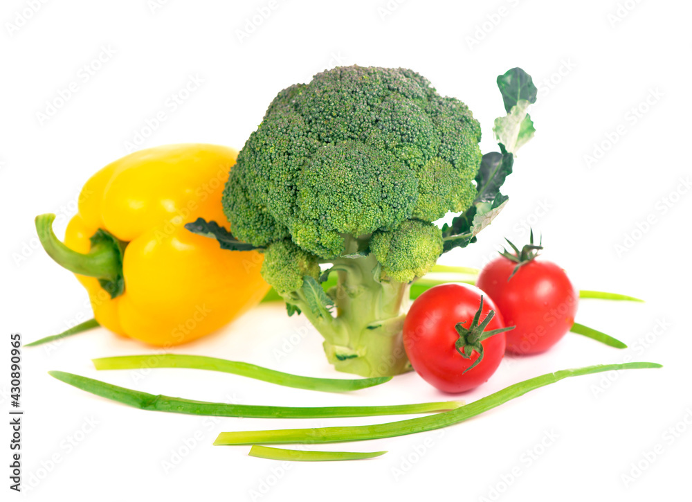 cabbage broccoli with tomatoes and green leaves isolated on white background. cabbage broccoli with tomatoes and green leaves isolated on white background.