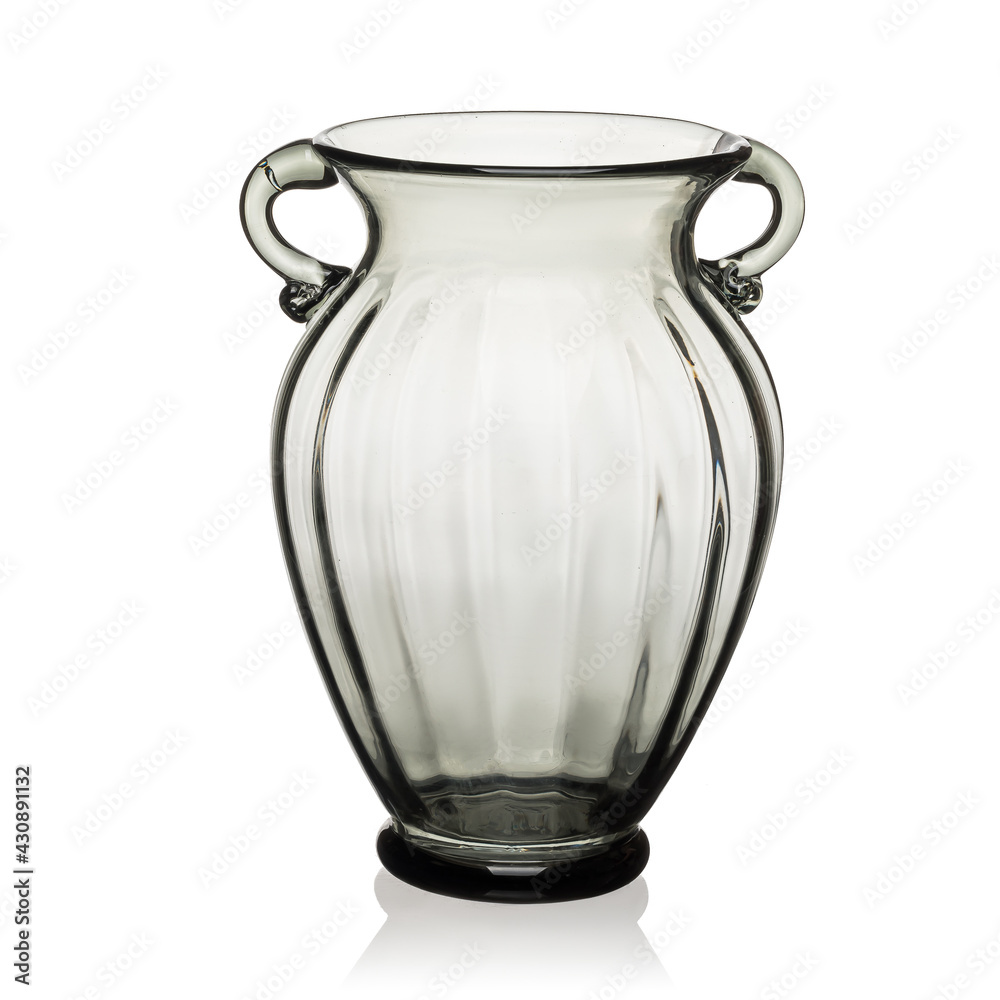 Glass transparent jug of brown color with two handles for drinks on a white isolated background.